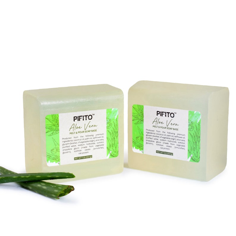 May include: Two clear rectangular bars of melt and pour soap base with a green aloe vera design and the text "PIFITO&trade; Aloe Vera MELT & POUR SOAP BASE" on the label.  The soap base is made with premium ingredients, including coconut oil, palm oil, and aloe vera.