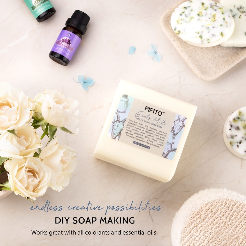 May include: A white bar of goat's milk melt and pour soap base with a goat illustration and the text "PIFITO Goats Milk Melt & Pour Soap Base" on the label. The soap base is surrounded by essential oils, dried flowers, and a white washcloth.