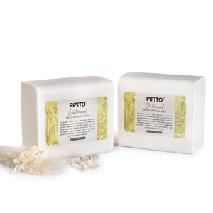 May include: Two white bars of PIFITO™ Oatmeal Melt & Pour Soap Base. The soap base is packaged in a white box with a yellow label that reads "PIFITO™ Oatmeal Melt & Pour Soap Base". The label also includes a list of ingredients.