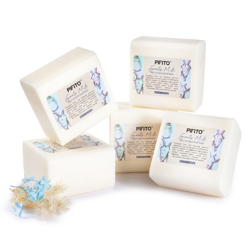 May include: Four white bars of goat's milk melt and pour soap base. The bars are stacked on top of each other. The label on the bars reads "PIFITO Goats Milk Melt & Pour Soap Base".