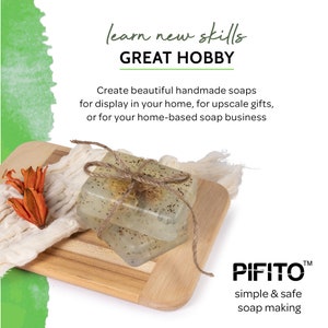 May include: Two clear handmade soaps with a speckled appearance, tied with twine and placed on a wooden cutting board. The soaps are on a white cloth with a small orange flower. The text "learn new skills GREAT HOBBY" is at the top of the image. The text "PIFITO&trade; simple & safe soap making" is at the bottom of the image.