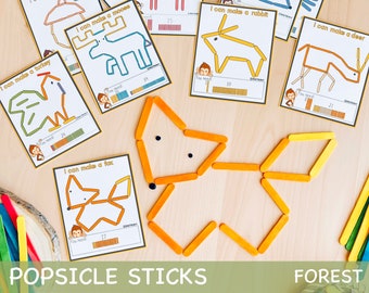 Puede incluir: Un conjunto de tarjetas imprimibles para una actividad artesanal utilizando palitos de helado para crear formas de animales. Las tarjetas presentan ilustraciones de un pavo, un alce, un zorro, un conejo y un ciervo, con instrucciones y la cantidad de palitos necesarios para cada animal. El texto en las tarjetas dice "Puedo hacer un pavo", "Puedo hacer un alce", "Puedo hacer un zorro", "Puedo hacer un conejo" y "Puedo hacer un ciervo".