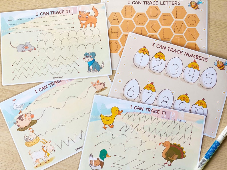 May include: Four printable worksheets for kids to practice tracing letters and numbers. The worksheets feature a variety of animal illustrations, including a cat, a dog, a duck, a turkey, a mouse, a pig, a goat, and a chick. The worksheets are titled "I Can Trace It" and "I Can Trace Letters" and "I Can Trace Numbers".