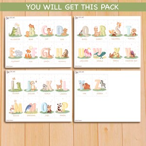 May include: A set of 26 alphabet flashcards featuring colorful letters with cute animal illustrations. Each card has a letter and a corresponding animal name printed below. The letters are in a pastel color scheme with a white background.