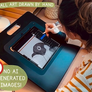 May include: A person is drawing a black and white illustration of a bird on a digital tablet. The tablet is on a black drawing board with a handle. The text "ALL ART DRAWN BY HAND" is visible at the top of the image. The text "NO AI GENERATED IMAGES!" is visible at the bottom of the image.