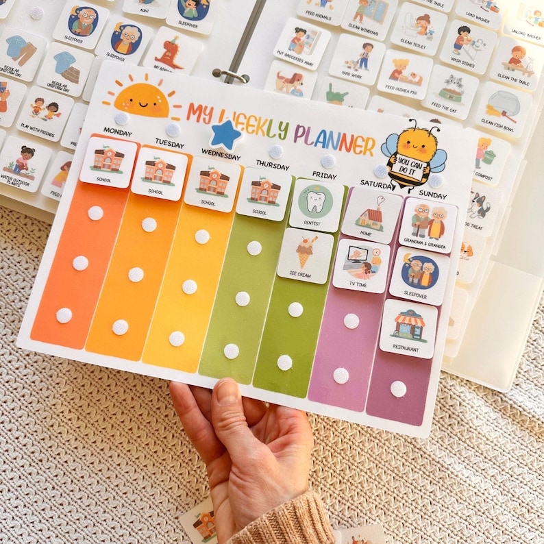 May include: A colorful weekly planner with a sun and bee graphic, featuring days of the week and activity icons. The planner has columns in orange, yellow, green, and pink, with white button accents. Text includes "MY WEEKLY PLANNER" and "YOU CAN DO IT."