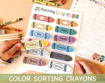 May include: A color sorting activity featuring crayon-shaped cards with color names like "Yellow," "Blue," and "Green." The image includes a matching worksheet and real crayons, promoting early childhood education and color recognition.
