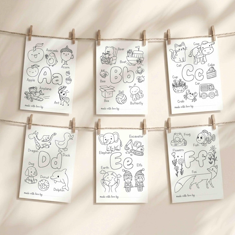 May include: Six white rectangular coloring pages featuring letters A through F with black line art illustrations of animals and objects. Each page includes the letter, corresponding words like Apple, Bear, Cat, Dragon, Elephant, and Fox, and a line for names.