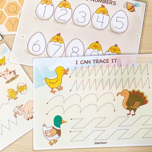 May include: A set of three printable tracing worksheets for kids. The worksheets feature a variety of animal illustrations, including a duck, a turkey, a pig, and a chick. The worksheets are designed to help children practice their fine motor skills and learn to trace lines and shapes.