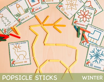 Puede incluir: Un conjunto de tarjetas de actividades imprimibles con temática invernal que presentan varias formas que se pueden crear utilizando palitos de helado. Las tarjetas incluyen instrucciones para hacer un árbol de Navidad, una vela, una estrella, un lazo, una flor de pascua, patines de hielo, un reno y un copo de nieve. Las tarjetas están impresas en papel verde y blanco con una ilustración de un duende de dibujos animados en cada tarjeta.