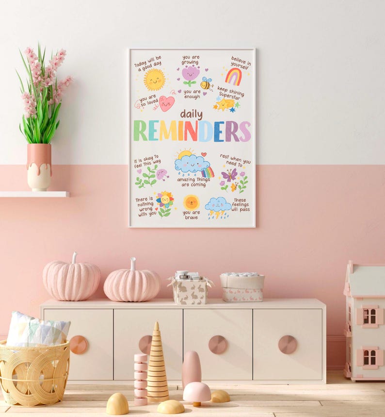 May include: A colorful poster with daily reminders for kids. The poster features illustrations of a sun, a rainbow, a butterfly, a cloud, and a flower. The text on the poster includes phrases like "Today will be a good day", "You are so loved", "You are enough", "Amazing things are coming", "You are brave", and "These feelings will pass".