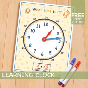 May include: A yellow and white learning clock with a red hour hand and a blue minute hand. The clock face has numbers 1 through 12 and markings for 5-minute intervals. The clock is labeled "What time is it?" and "Learning Clock".