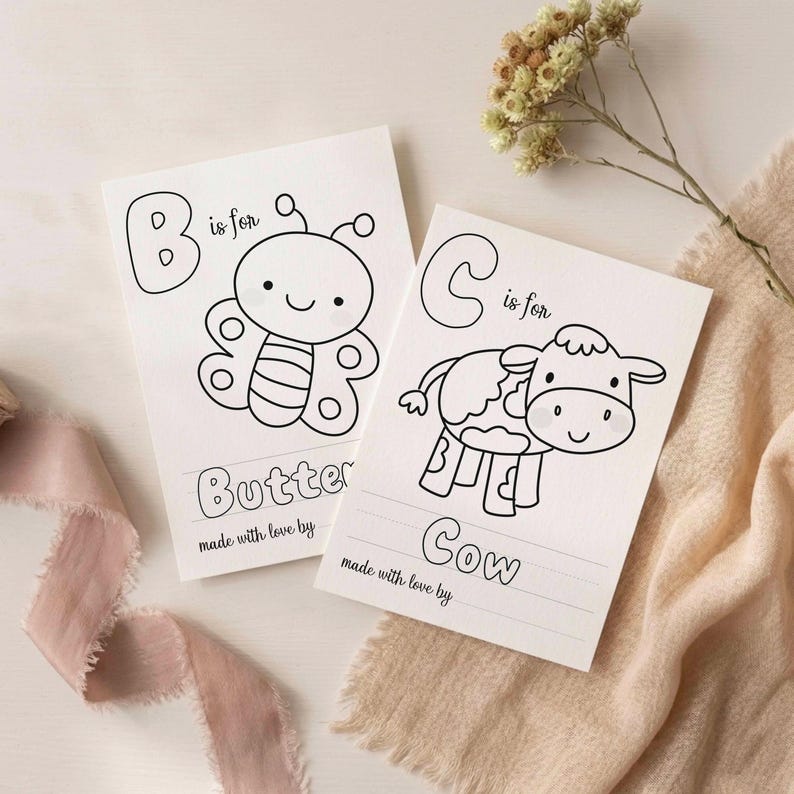 May include: Two white rectangular coloring cards featuring black line art. One card shows a butterfly with the text B is for Butterfly and made with love by. The other card shows a cow with the text C is for Cow and made with love by.