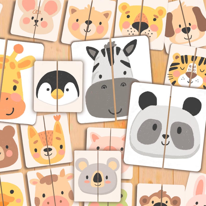 May include: A collection of square animal puzzle pieces with a variety of cute animal faces, including a zebra, panda, and penguin. The pieces are divided in half, ready to be matched. The background is a light wood grain.
