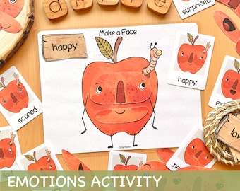 May include: A printable emotions activity for kids featuring a red apple with different facial expressions. The activity includes a set of cards with various emotions, such as happy, sad, scared, and loved. The cards are designed to be cut out and used to create different facial expressions on the apple.