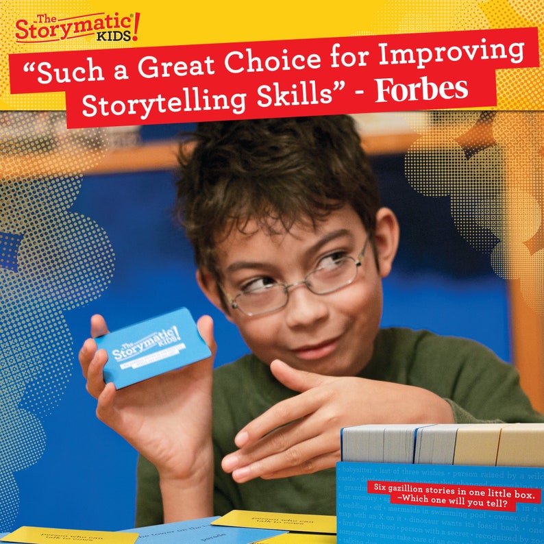 May include: A young person wearing glasses holds a blue card with the text "The Storymatic! KIDS!"  The card is part of a game called "The Storymatic!"  The text on the card reads "Six gazillion stories in one little box. -Which one will you tell?"
