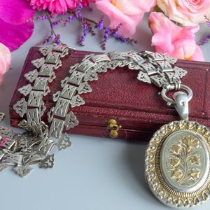 Antique Victorian ivy and thistle silver and gold locket and book chain