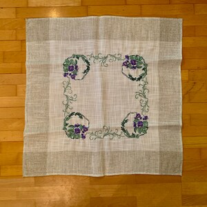 White and Beige Tablecloth with Purple Flowers and Greenery