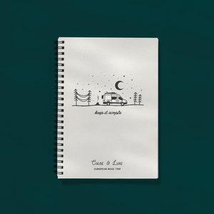 May include: A notebook with a spiral binding, featuring a black and white drawing of a campervan under a crescent moon and stars. The words "keep it simple" are below the image, with "Chloe & Luke" and "EUROPEAN ROAD TRIP" at the bottom.