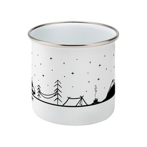 May include: White enamel camping mug with a black and white illustration of a mountain, trees, a tent, and a campfire. The mug has a silver rim.