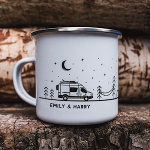 May include: White enamel camping mug with a black and white illustration of a camper van, trees, and a crescent moon. The mug has the text "Emily & Harry" printed on the bottom.
