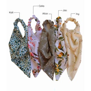 May include: Four floral patterned headbands in different colors and patterns. The headbands are arranged in a row from left to right. The headbands are labeled "Kali", "Celia", "Alice", "Jas", and "Ivy".