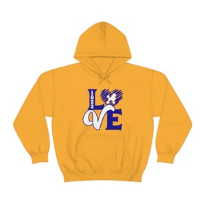 May include: A yellow hoodie with a blue and white graphic design that says "LOVE" with a poodle silhouette inside a heart and the number "1922" on the left side of the "L".
