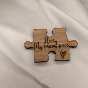 May include: Wooden puzzle piece with the text "My Henry missing piece" and a small heart.