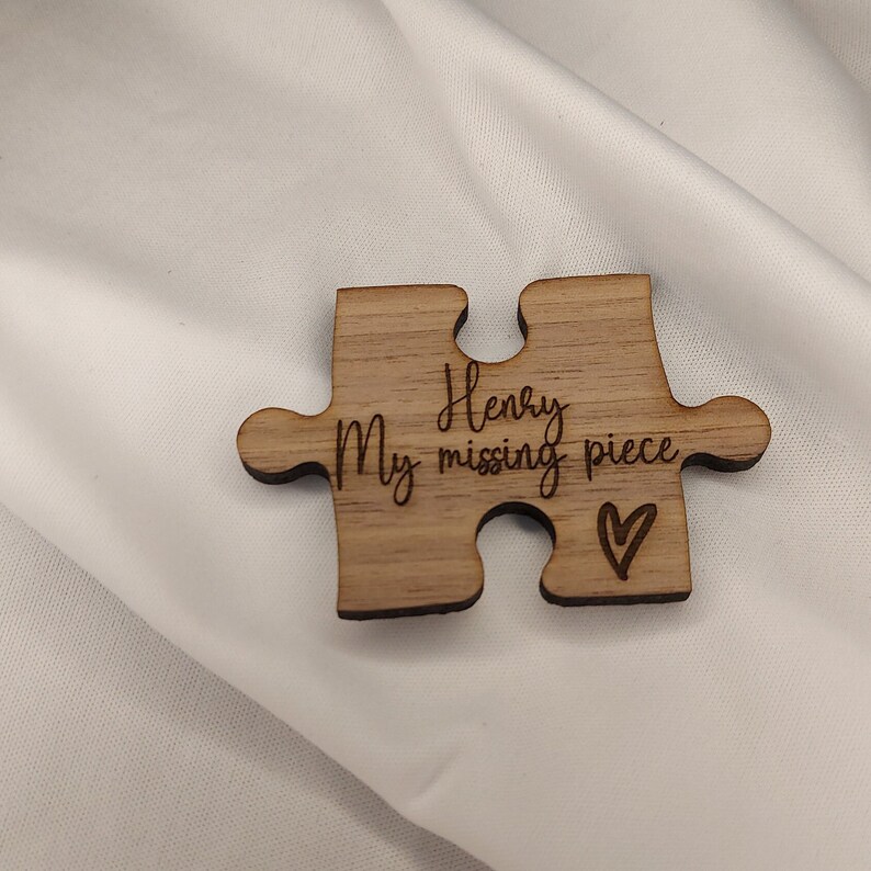 May include: Wooden puzzle piece with the text "My Henry missing piece" and a small heart.