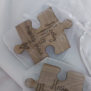 Missing piece showwn in a white organza bag.