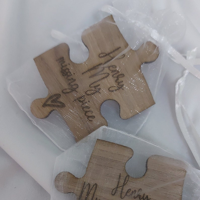 Missing piece showwn in a white organza bag.