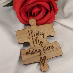 May include: Wooden puzzle piece with the text "Henry My missing piece" and a small heart engraved on the bottom.