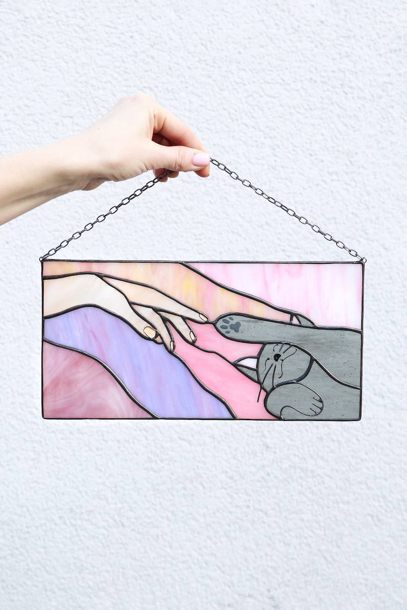 Suncatcher Cat reaching for a human hand with its paw Stained glass window panel Hanging home decor Glass wall art Gift for cat lovers Pink and purple
