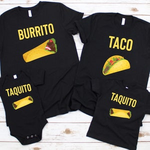 May include: A set of four black t-shirts with a Mexican food theme. The shirts feature the words "Burrito", "Taco", and "Taquito" with illustrations of the food items.