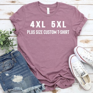 May include: A mauve coloured t-shirt with the text "4XL 5XL PLUS SIZE CUSTOM T-SHIRT" printed in white.