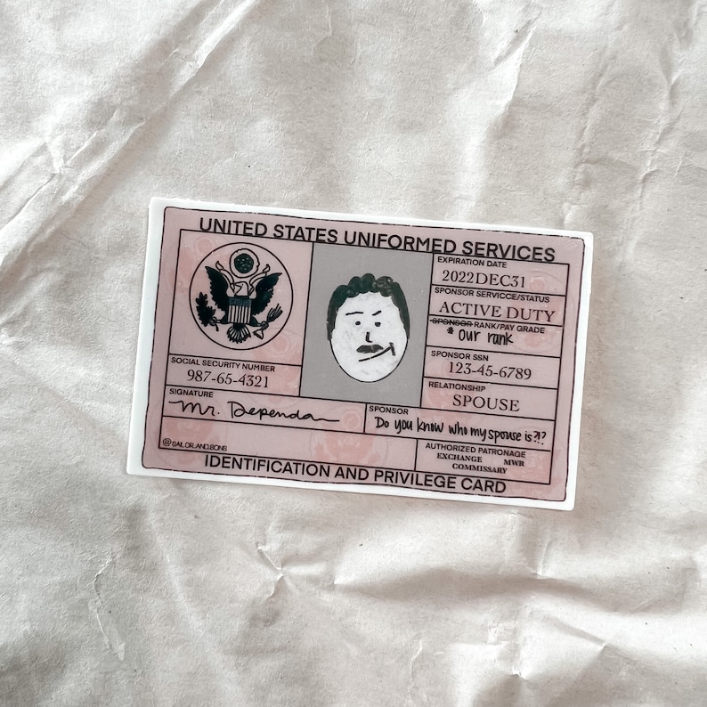 May include: A pink and white sticker designed to look like a United States Uniformed Services ID card. It features a cartoon drawing of a person, the name "Mr. Dependa", and the question "Do you know who my spouse is?!?".