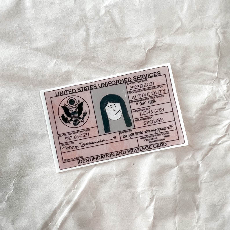 May include: A sticker designed to look like a United States Uniformed Services ID card. It features a cartoon illustration, text, and the phrase "Do you know who my spouse is??" in pink and white. The expiration date is 2022DEC31.