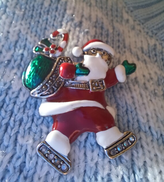 Liz Claiborne signed Christmas brooch. Ice skating