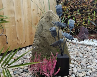 Thistle sculpture with a charred wood base, hand forged by a Scottish blacksmith