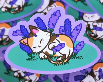 May include: A sticker featuring a cartoon calico cat sleeping in a bed of purple lavender flowers. The cat is curled up on its side with its paws tucked under its chin. The background is a light green colour.