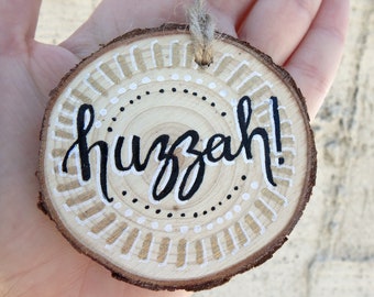 3.25 inch huzzah! quote hand painted lettering small natural wood slice ornament - renaissance faire hanging wall decor - congrats art gift