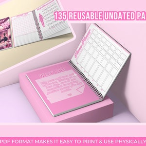 May include: Pink and white fitness planner with 135 reusable undated pages. The planner has a spiral binding and features a quote on the cover: "My past self didn't know what a difference a day, and a commitment to myself could make. Choose to make positive decisions for my health."