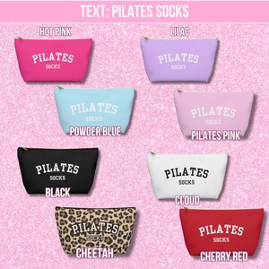 May include: Ten different colored zippered pouches with the text "PILATES SOCKS" printed on them. The pouches are in the colors hot pink, lilac, powder blue, black, cheetah print, cloud white, and cherry red.