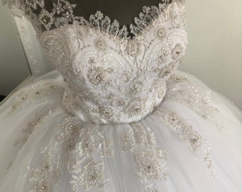 Full wedding dress. Gold lace beaded dress. Wedding dress with train. Sleeveless wedding dress. Stunning wedding gown. Classic wedding dress