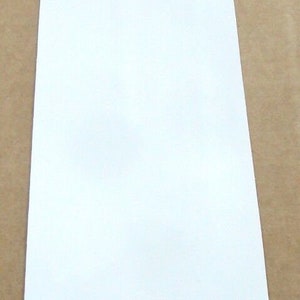 Canto de melamina blanca de 7/8&quot; x 120&#39;&#39; con adhesivo termofusible preencolado de 0,875&quot;