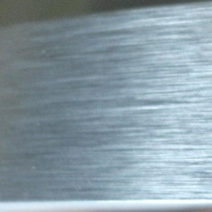 Aluminum Brushed Metal 1MM PVC edgebanding 1-1/2" x 120" with preglued adhesive