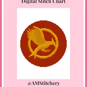 May include: A digital stitch chart featuring a pixelated gold mockingjay bird emblem centered within a solid dark red circle. The text Digital Stitch Chart is printed at the top, and the handle @AMStitchery is printed at the bottom.