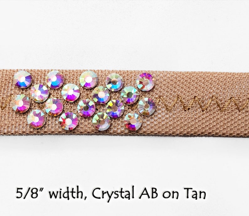 May include: Tan ribbon trim with a 5/8 inch width, decorated with iridescent crystal AB rhinestones.