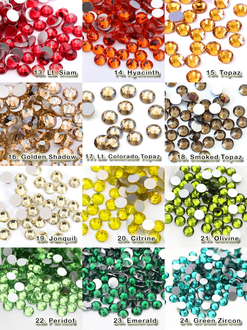 K&ouml;nnte beinhalten: Eine Sammlung von zw&ouml;lf verschiedenen Gruppen runder, facettierter Glas-Strasssteine in diversen Farben, nummeriert von 13 bis 24, darunter Rot-, Orange-, Gelb-, Braun-, Gr&uuml;n- und Blaut&ouml;ne, jeweils mit einer flachen, silberfarbenen R&uuml;ckseite.