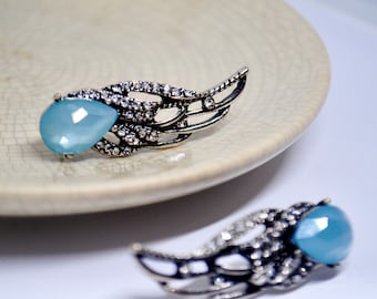 Handmade vintage style silver colour angel wing stud earring with muted blue crystal